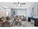 Cozy living room with two sofas, a ceiling fan, and large windows at 1694 Pheasant Dr, Atlanta, GA 30238