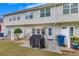 Backyard with a concrete patio, grill, an umbrella, seating, and some greenery at 2083 Hasel St, Lawrenceville, GA 30044