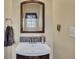 This is a half bath with nice vanity, countertop, and mirror at 2083 Hasel St, Lawrenceville, GA 30044