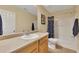Bathroom with a single sink vanity, toilet, and shower-tub combo at 2083 Hasel St, Lawrenceville, GA 30044