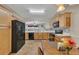 Bright eat-in kitchen with tile backsplash and black appliances at 2083 Hasel St, Lawrenceville, GA 30044