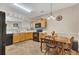 Eat-in kitchen features tile backsplash and black appliances at 2083 Hasel St, Lawrenceville, GA 30044