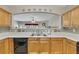 The kitchen sink area features tiled backsplash, plenty of countertop space, and an open view to the living area at 2083 Hasel St, Lawrenceville, GA 30044