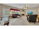 The living room is spacious, with natural light, a fireplace, and neutral carpet at 2083 Hasel St, Lawrenceville, GA 30044