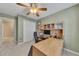 Home office with desk, built-in shelving, carpet, and neutral paint at 2083 Hasel St, Lawrenceville, GA 30044