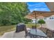 Covered grill and patio set with an umbrella at 2083 Hasel St, Lawrenceville, GA 30044