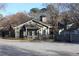 Residential home showing fencing, gated yard, and sloped roof and chimney at 2697 Vinings Central Dr # 61, Atlanta, GA 30339