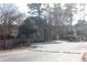 View of a single-story home featuring a sloped roof, handicap parking, and a gated fence at 2697 Vinings Central Dr # 61, Atlanta, GA 30339