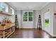 Stylish bar area with a wine rack, wooden countertop, and plenty of natural light from the nearby window at 2980 Prestwood Dr, Cumming, GA 30040