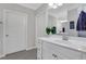 Bright bathroom with white vanity, cabinets, and a large mirror at 2980 Prestwood Dr, Cumming, GA 30040