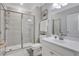 Modern bathroom featuring a glass shower enclosure and sleek white vanity at 2980 Prestwood Dr, Cumming, GA 30040