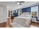 Spacious bedroom features hardwood floors, a ceiling fan, and a work desk area at 2980 Prestwood Dr, Cumming, GA 30040