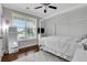 A sun-lit bedroom featuring a ceiling fan and large windows at 2980 Prestwood Dr, Cumming, GA 30040