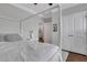 Bedroom with a view of ensuite bathroom. White trim and a white comforter at 2980 Prestwood Dr, Cumming, GA 30040