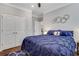 Comfortable bedroom featuring a plush bed with dark blue bedding and ample closet space at 2980 Prestwood Dr, Cumming, GA 30040