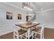 Stylish dining room with modern light fixture and hardwood floors at 2980 Prestwood Dr, Cumming, GA 30040