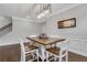 Dining area featuring a modern chandelier and wood floors at 2980 Prestwood Dr, Cumming, GA 30040