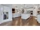 Open floor plan showcasing the kitchen, living room, and staircase, creating a seamless and inviting living space at 2980 Prestwood Dr, Cumming, GA 30040