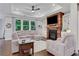 Cozy living room featuring a fireplace, built-in shelving, and ample seating at 2980 Prestwood Dr, Cumming, GA 30040