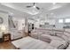 Spacious living room with a plush sectional sofa, hardwood floors, and an open floor plan to the kitchen at 2980 Prestwood Dr, Cumming, GA 30040