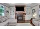 Comfortable living room showcasing built-in shelving and a fireplace at 2980 Prestwood Dr, Cumming, GA 30040