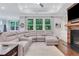 Bright living room with a large sectional sofa and natural light at 2980 Prestwood Dr, Cumming, GA 30040