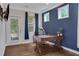 This office space features hardwood floors, natural light, and a blue accent wall at 2980 Prestwood Dr, Cumming, GA 30040