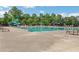 Large community pool with chairs, umbrellas, and a slide offers endless summer fun for all ages at 2980 Prestwood Dr, Cumming, GA 30040