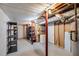 Unfinished basement with utility and storage options including shelving and water heater at 3359 Villa Ln, Douglasville, GA 30135