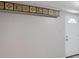 Unfinished basement featuring painted concrete walls and a white entry door at 3359 Villa Ln, Douglasville, GA 30135