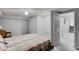 Bright bedroom with carpeted floors, closet space, and an adjacent doorway to hallway and stairs at 3359 Villa Ln, Douglasville, GA 30135
