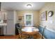 Charming breakfast nook featuring wainscoting and a round table perfect for casual dining at 3359 Villa Ln, Douglasville, GA 30135