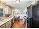Updated kitchen featuring stainless steel appliances, modern cabinetry, and an adjacent breakfast nook at 3359 Villa Ln, Douglasville, GA 30135