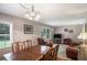 Open-concept living room with combined living and dining areas, ample natural light, and hardwood floors at 3359 Villa Ln, Douglasville, GA 30135