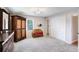 Main bedroom featuring carpet, closet space, and warm natural light at 3359 Villa Ln, Douglasville, GA 30135