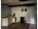 Basement needing repairs, featuring a utility sink and fixtures, with visible wall repairs and exposed ceiling beams at 372 Nalley Dr, Stone Mountain, GA 30087
