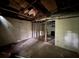 Unfinished basement with visible ceiling beams; renovation in progress with exposed framing and ample space for customization at 372 Nalley Dr, Stone Mountain, GA 30087