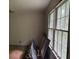 Bedroom awaiting transformation, featuring large windows for natural light at 372 Nalley Dr, Stone Mountain, GA 30087