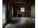 Living room under renovation, with hardwood floors and natural light at 372 Nalley Dr, Stone Mountain, GA 30087