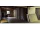 Renovated living space featuring exposed framing, and original hardwood floors at 372 Nalley Dr, Stone Mountain, GA 30087