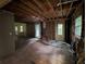 Open-concept room under renovation, offering a spacious layout with lots of potential at 372 Nalley Dr, Stone Mountain, GA 30087