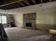 Partially renovated living room featuring stone fireplace, offering renovation potential at 372 Nalley Dr, Stone Mountain, GA 30087