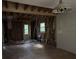 Living room under renovation, showcasing exposed framing and hardwood floors at 372 Nalley Dr, Stone Mountain, GA 30087