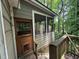 Porch with screens needing repair next to weathered house door at 372 Nalley Dr, Stone Mountain, GA 30087