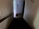 View of the stairwell descending into the basement, broom present in the background at 372 Nalley Dr, Stone Mountain, GA 30087