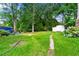 Spacious backyard with lush greenery and a shed, perfect for outdoor activities and storage at 6250 Graceland Cir, Morrow, GA 30260