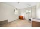 A simple bedroom with a wooden dresser, ample natural light, and a utilitarian decor at 6250 Graceland Cir, Morrow, GA 30260