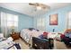 Cozy bedroom featuring a ceiling fan, ample natural light, and potential for personalization at 6250 Graceland Cir, Morrow, GA 30260