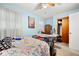 Bright bedroom with ceiling fan, abundant natural light, and potential for creating a comfortable retreat at 6250 Graceland Cir, Morrow, GA 30260