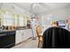Efficient kitchen with white cabinets, essential appliances, and a cozy dining nook at 6250 Graceland Cir, Morrow, GA 30260